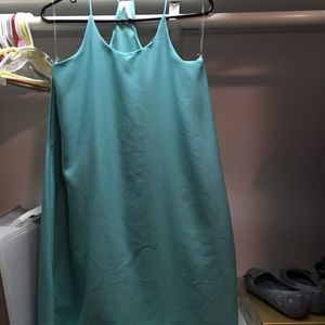 Teal dress goes to about the knees